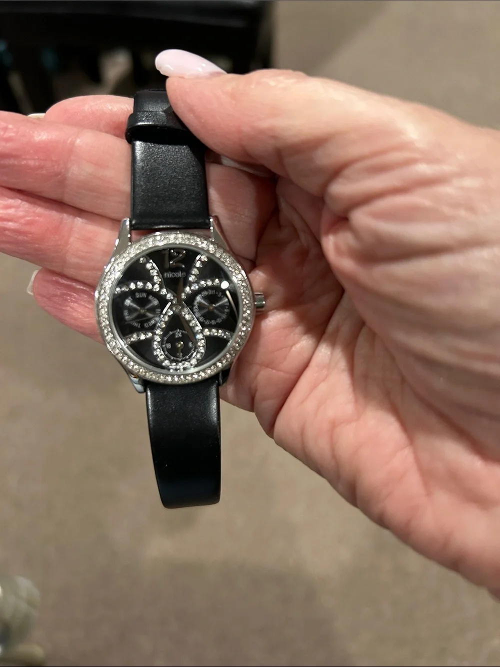 633. NWOT Nicole Miller Black & Crystal Watch‎ with genuine black leather band.